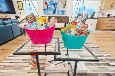 two baskets sitting on a table in a living room at G- Luxe NoHo Family Home near Universal 15m and Hollywood 10m in Hewitt