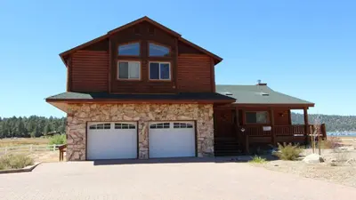 a house with two garage doors in front of it at Lakeside Oasis in Big Bear Lake
