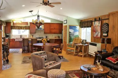 a living room filled with furniture and a kitchen at Fire Pit & Steps to Village- Village Hideaway in Big Bear Lake