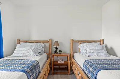 two beds sitting next to each other in a bedroom at Sea to Ski Retreat in Big Bear Lake