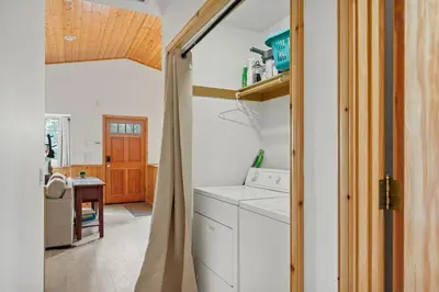 a kitchen with a washer and dryer in a room at Sea to Ski Retreat in Big Bear Lake