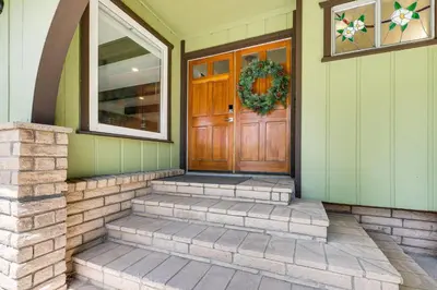 a front door of a house with a wreath on it at Private Hot Tub at Dog-Friendly Lake Arrowhead Gem in Lake Arrowhead