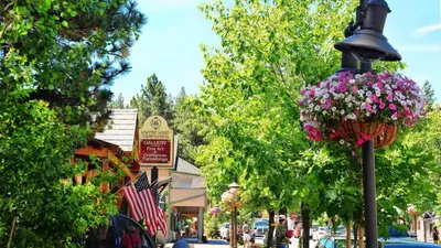 a street in a town with a street light with flowers at Hot Tub/Game Tables/Dogs OK - Aspen Glen in Big Bear Lake