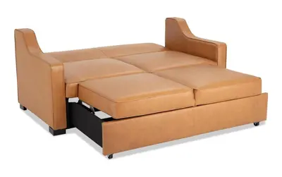 a brown leather couch with a black drawer at PRIVATE modern studio Guesthouse in Los Angeles