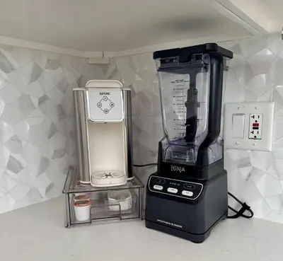 a blender sitting on a counter next to a blender at PRIVATE modern studio Guesthouse in Los Angeles