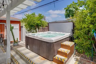 a hot tub in the backyard of a house at 2 Mi to Cal State Long Beach Bungalow with Hot Tub! in Long Beach