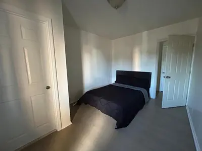 a bedroom with a bed in the corner of a room at Hollywood Home in Los Angeles