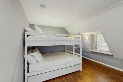 a bedroom with two bunk beds in a attic at Elevation Escape in Lake Arrowhead