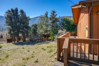 a balcony of a house with a view of a yard at Mountain-View Haven with Deck in Pine Mountain Club in Frazier Park