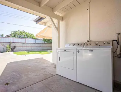 a white appliance sitting outside of a house at New Renovated 3B2B house in West Covina
