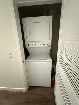 a white washer and dryer in a closet at Poolside Palace in Los Angeles