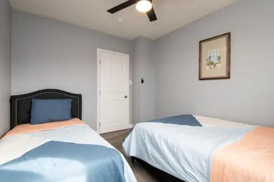 a bedroom with two beds and a ceiling fan at 3bedroom 2bath Unit complementary parking onsite in Los Angeles