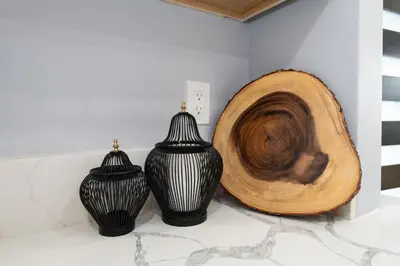 three black and white vases sitting on a counter at 3bedroom 2bath Unit complementary parking onsite in Los Angeles