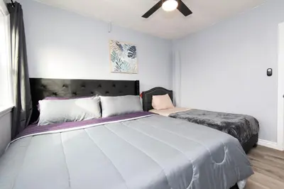 a bedroom with a large bed in a room at 3bedroom 2bath Unit complementary parking onsite in Los Angeles