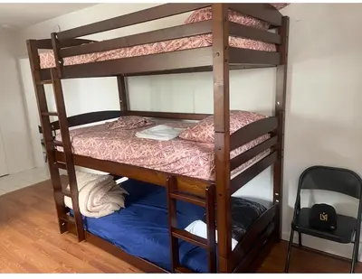 a couple of bunk beds in a room at Females room bunk beds in Los Angeles