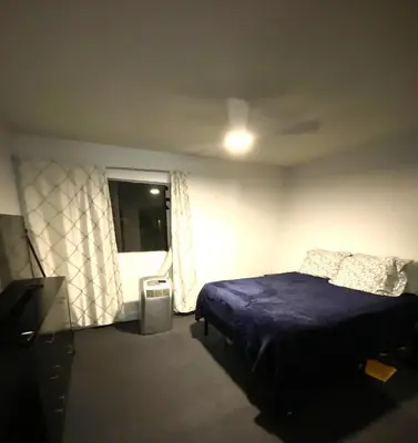 a bedroom with a bed and a window at Luxury condo in the heart of LA in Los Angeles