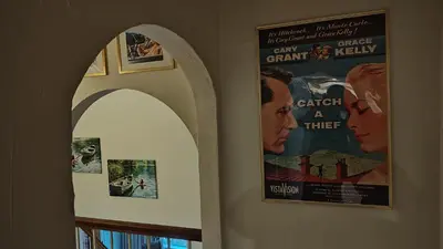 two framed movie posters on the walls of a building at Golden House in Santa Clarita