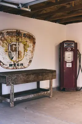 a bench next to a wall next to a gas pump at Malibu ranch retreat in Malibu