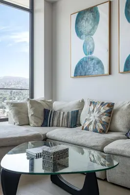 a living room with a couch and a glass table at Seven Mile Penthouse Dream Hollywood View Pool in Los Angeles
