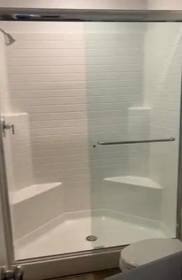 a glass shower in a bathroom with a toilet at HelloLA in Whittier