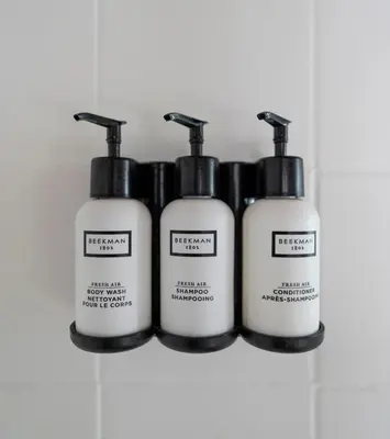 a group of four bottles of soap on a shelf at Malibu Villa with Beach Access and Ocean View in Malibu