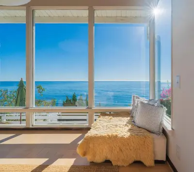 a room with a large window with a view of the ocean at Malibu Villa with Beach Access and Ocean View in Malibu