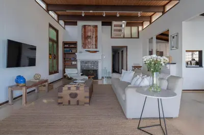 a living room with a couch and a table at Malibu Villa with Beach Access and Ocean View in Malibu