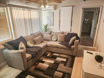 a living room with a couch and a table at Relaxing Cozy Back House with Backyard in Upland