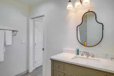 a bathroom with a sink and a mirror at Walk to Dtwn Tehachapi Updated Getaway with Yard! in Tehachapi