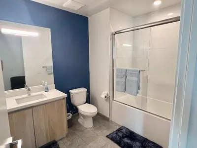 a bathroom with a toilet sink and a shower at Penthouse with Hollywood Sign View 2 Bedrooms with 3 Beds in Los Angeles