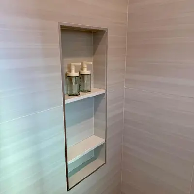 a glass medicine cabinet with two candles in it at Guesthouse in Hewitt