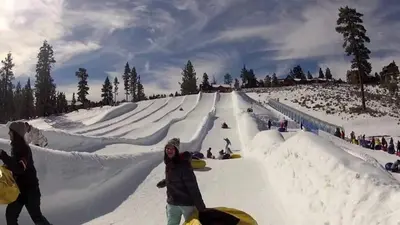 a group of people playing in the snow at The Wilderness Haven in Big Bear Lake