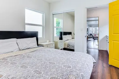 a bedroom with a bed and a mirror at 1 Mi to Dtwn LA Artists Retreat with Zen Garden in Los Angeles