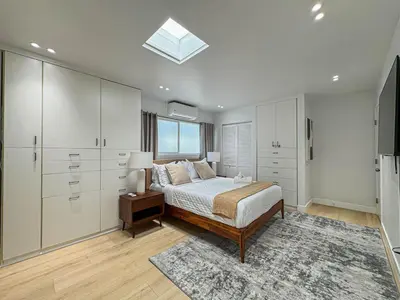 a bedroom with a bed and a dresser and a window at Seaside 2BR with Ocean View and Roof Garden - VE3-MDR in Los Angeles
