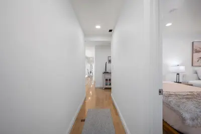 a hallway leading to a bedroom with a bed at Ocean Views in Long Beach in Long Beach