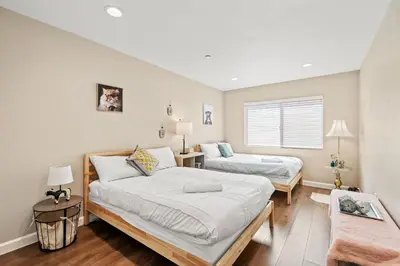 a bedroom with two beds and a couch at Heartwarming Family Stay 10 Min Walk to Pomona Valley Hospital in Pomona