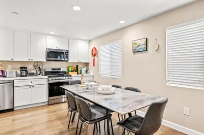a kitchen with a dining room table and chairs at Heartwarming Family Stay 10 Min Walk to Pomona Valley Hospital in Pomona