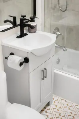 a white bathroom with a sink and a shower at Stylish 5 Bedroom Villa with Pool near Disney - Luxury Family Retreat in Anaheim