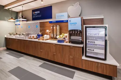 an apple store with a counter with an appleasteryasteryasteryasteryasteryasteryastery at Holiday Inn Express & Suites Bakersfield Airport by IHG in Bakersfield