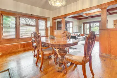 a dining room with a wooden table and chairs at 2 Mi to USC Central Home in Los Angeles! in Los Angeles