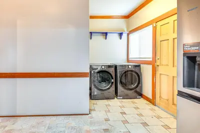 a laundry room with a washer and dryer at 2 Mi to USC Central Home in Los Angeles! in Los Angeles