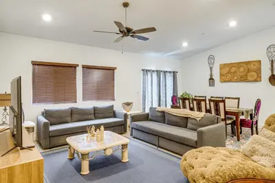 a living room with a couch and a table at 9 Mi to Dtwn Bakersfield Pet-Friendly Home in Bakersfield