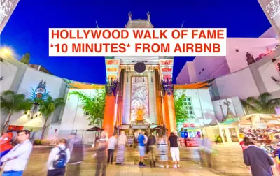a group of people walking in front of a building at Enchanting Private Hollywood Hills Guest House with Tranquil Tree-Top Views, Magical Outdoor Living Room and Patio and Zen Garden, In LA's Most Desirable, Central, Serene Area and Only 2 Minutes from Hollywood Boulevard in Los Angeles