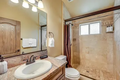 a bathroom with a sink and a shower at Walkable Big Bear Lake Home with Private Hot Tub! in Big Bear Lake