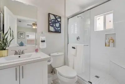a bathroom with a toilet and a sink and a shower at Travel Haven - Great Location - Quiet Area in Long Beach