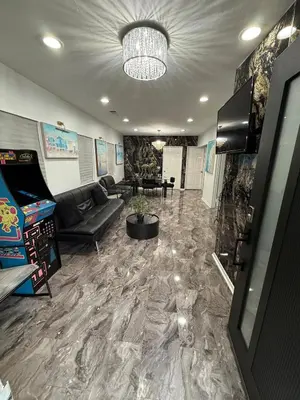 a living room with a couch and a pool table at LUXURY VILLA Estate Oasis in Downey