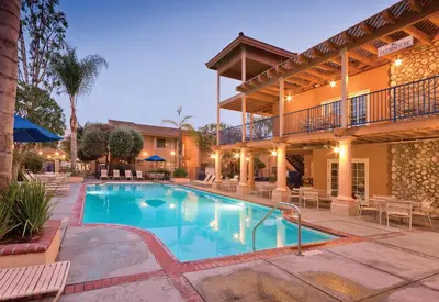 a swimming pool in front of a hotel at Wyndham Dolphin's Cove 1BR Suite with Resort Access in Anaheim