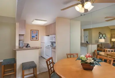 a kitchen and dining room with a table and a kitchen and a dining room at Wyndham Dolphin's Cove 1BR Suite with Resort Access in Anaheim
