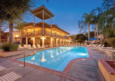 a swimming pool in front of a building at Wyndham Dolphin's Cove 2BR Suite with Resort Access in Anaheim