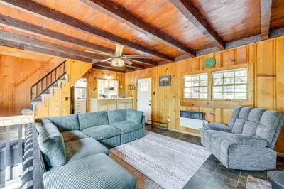 a living room with two couches and a staircase at Between Big Bear and Lake Arrowhead - Cabin with View! in Running Springs